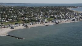 4K aerial stock footage of flying by beachfront homes in a coastal neighborhood in Stratford, Connecticut Aerial Stock Footage | AX91_120