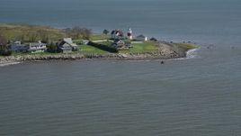 4K aerial stock footage of tilting up from the water, revealing Stratford Point Light in Stratford, Connecticut Aerial Stock Footage | AX91_122