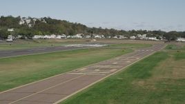 4K aerial stock footage of flying by runways at Tweed New Haven Regional Airport, New Haven, Connecticut Aerial Stock Footage | AX91_137
