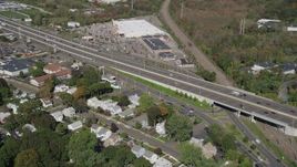 4K aerial stock footage fly over suburban homes, pan across Connecticut Turnpike freeway, New Haven, Connecticut Aerial Stock Footage | AX91_140