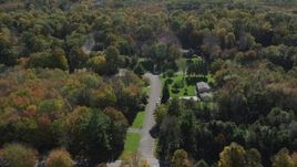 4K aerial stock footage video of flying over forest and homes in autumn, Guilford, Connecticut Aerial Stock Footage | AX91_172