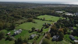 4K aerial stock footage of flying over rural neighborhoods in autumn, Guilford, Connecticut Aerial Stock Footage | AX91_186