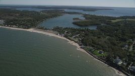 4K aerial stock footage of approaching homes and beach near Hashamomuck Pond, Southold, New York Aerial Stock Footage | AX91_193