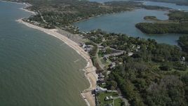 4K aerial stock footage video of flying by homes on the beach near Hashamomuck Pond, Southold, New York Aerial Stock Footage | AX91_194