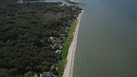 4K aerial stock footage of flying over beachfront homes, revealing Wooley Pond, Southampton, New York Aerial Stock Footage | AX91_204