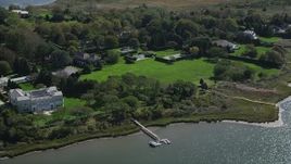 4K aerial stock footage of a view of upscale homes near the water, Southampton, New York Aerial Stock Footage | AX91_213
