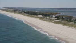 4K aerial stock footage of flying by row of beachfront mansions, Southampton, New York Aerial Stock Footage | AX91_224
