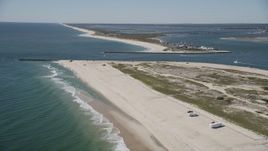 4K aerial stock footage fly over RVs on a beach to approach Shinnecock Inlet, Southampton, New York Aerial Stock Footage | AX91_230