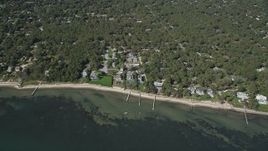 4K aerial stock footage of approaching beachside homes with docks, Hampton Bays, New York Aerial Stock Footage | AX91_233