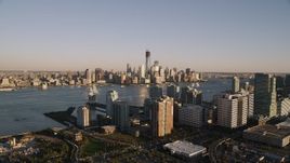 4K aerial stock footage Approaching Lower Manhattan, seen from Jersey City, New York, New York, sunset Aerial Stock Footage | AX93_001