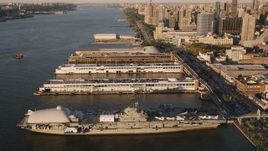 4K aerial stock footage Approaching the USS Intrepid, tilting down, New York, New York, sunset Aerial Stock Footage | AX93_008