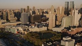 4K aerial stock footage Flying by Midtown Manhattan skyscrapers, pan right, New York, New York, sunset Aerial Stock Footage | AX93_009