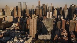 4K aerial stock footage Flying by Midtown Manhattan skyscrapers, New York, New York, sunset Aerial Stock Footage | AX93_010
