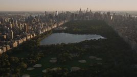 4K aerial stock footage Flying over Central Park, panning right, New York, New York, sunset Aerial Stock Footage | AX93_020