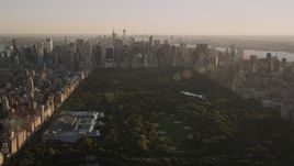 4K aerial stock footage Jacqueline Kennedy Onassis Reservoir, Central Park, Midtown, New York, sunset Aerial Stock Footage | AX93_021