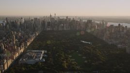 4K aerial stock footage Approaching Midtown Manhattan, from Central Park, New York, New York, sunset Aerial Stock Footage | AX93_022