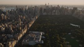 4K aerial stock footage Approaching Metropolitan Museum of Art, tilt down, New York, New York, sunset Aerial Stock Footage | AX93_023