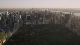 4K aerial stock footage Approaching Midtown Manhattan, from Central Park, New York, New York, sunset Aerial Stock Footage | AX93_025