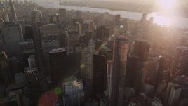 4K aerial stock footage Flying by Midtown Manhattan, tilt down, New York, New York, sunset Aerial Stock Footage | AX93_028