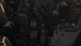 4K aerial stock footage of Midtown Manhattan skyscrapers, reveal Empire State Building, New York, sunset Aerial Stock Footage | AX93_030