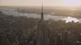 4K aerial stock footage Flying by the Empire State Building, Midtown Manhattan, New York, sunset Aerial Stock Footage | AX93_033