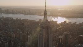 4K aerial stock footage Flying by the Empire State Building, Midtown Manhattan, New York, sunset Aerial Stock Footage | AX93_034