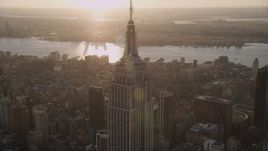 4K aerial stock footage Flying by the Empire State Building, Midtown Manhattan, New York, sunset Aerial Stock Footage | AX93_035