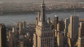 4K aerial stock footage Flying by top of Empire State Building, Midtown Manhattan, New York, sunset Aerial Stock Footage | AX93_038