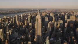 4K aerial stock footage Flying by the Empire State Building, Midtown Manhattan, New York, sunset Aerial Stock Footage | AX93_041
