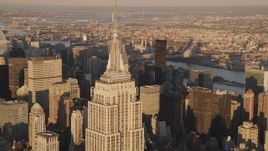 4K aerial stock footage Flying by the Empire State Building, Midtown Manhattan, New York, sunset Aerial Stock Footage | AX93_044