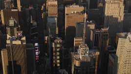 4K aerial stock footage Flying by Times Square, tilt down, Midtown Manhattan, New York, sunset Aerial Stock Footage | AX93_046