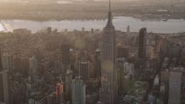 4K aerial stock footage Flying by the Empire State Building, Midtown Manhattan, New York, sunset Aerial Stock Footage | AX93_051