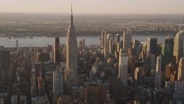 4K aerial stock footage Flying by the Empire State Building, Midtown Manhattan, New York, sunset Aerial Stock Footage | AX93_053
