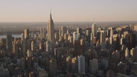 4K aerial stock footage Flying by the Empire State Building, Midtown Manhattan, New York, sunset Aerial Stock Footage | AX93_055