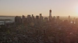 4K aerial stock footage Flying by Lower Manhattan skyline, seen from Lower East Side, New York, sunset Aerial Stock Footage | AX93_057