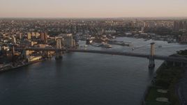 4K aerial stock footage Approaching the Williamsburg Bridge, East River, New York, New York, sunset Aerial Stock Footage | AX93_058