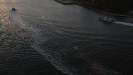 4K aerial stock footage Flying over East River, reveal Lower Manhattan, Manhattan Bridge, New York, sunset Aerial Stock Footage | AX93_061