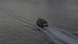 4K aerial stock footage Tracking a ferry on the East River; New York, New York, sunset Aerial Stock Footage | AX93_062