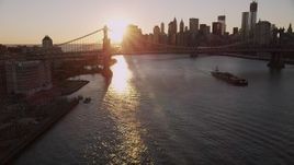 4K aerial stock footage Brooklyn Bridge, Lower Manhattan, ascend Manhattan Bridge, New York, sunset Aerial Stock Footage | AX93_063