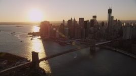 4K aerial stock footage Approaching Brooklyn Bridge, Lower Manhattan, New York, New York, sunset Aerial Stock Footage | AX93_065
