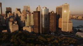 4K aerial stock footage Flying by skyscrapers near Battery Park, Lower Manhattan, New York, sunset Aerial Stock Footage | AX93_077
