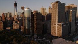 4K aerial stock footage Flying by skyscrapers, East River, Lower Manhattan, New York, New York, sunset Aerial Stock Footage | AX93_078