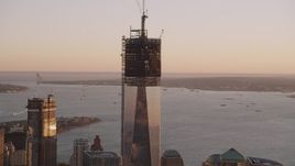 4K aerial stock footage Flying by Freedom Tower, One World Trade Center, Lower Manhattan, sunset Aerial Stock Footage | AX93_088