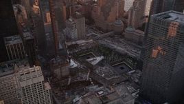 4K aerial stock footage Flying by the World Trade Center Memorial, Lower Manhattan, New York, sunset Aerial Stock Footage | AX93_096