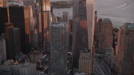 4K aerial stock footage Tilting down World Trade Center buildings, Lower Manhattan, New York, sunset Aerial Stock Footage | AX93_099