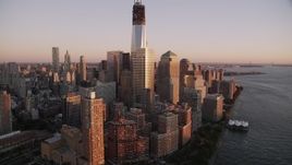 4K aerial stock footage Flying by World Trade Center, Freedom Tower, Lower Manhattan, New York, sunset Aerial Stock Footage | AX93_100