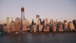 4K aerial stock footage Flying by Freedom Tower, Lower Manhattan, Hudson River, New York, sunset Aerial Stock Footage | AX93_103