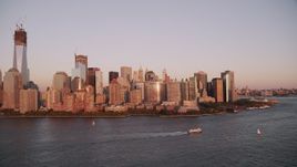 4K aerial stock footage Flying by Lower Manhattan skyline, Hudson River, New York, New York, sunset Aerial Stock Footage | AX93_104
