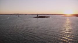 4K aerial stock footage Approaching the Statue of Liberty, New York, New York, sunset Aerial Stock Footage | AX93_105