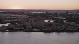 4K aerial stock footage of Port Liberte condominiums, townhouses, Jersey City, New Jersey, sunset Aerial Stock Footage | AX93_125